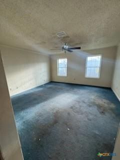 empty room featuring a textured ceiling