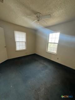 unfurnished room with ceiling fan