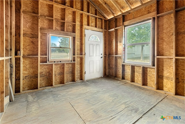 misc room with vaulted ceiling and plenty of natural light