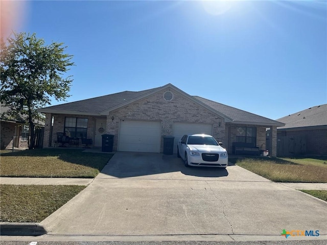 ranch-style home featuring a front lawn, brick siding, concrete driveway, and an attached garage