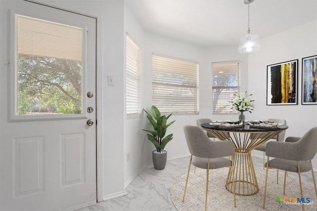 dining space with plenty of natural light