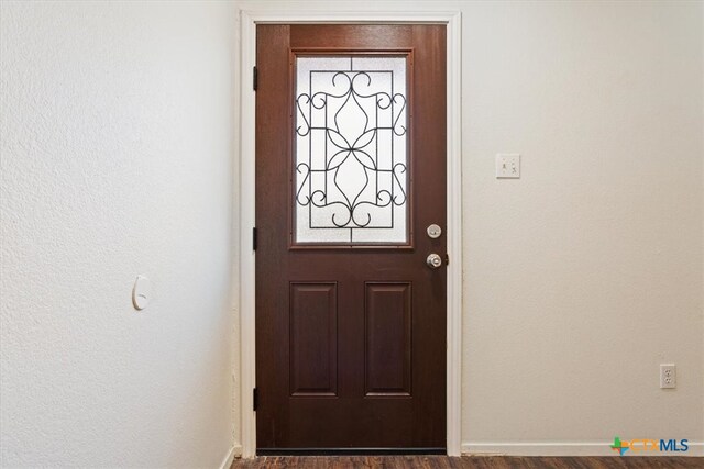 interior space with dark wood-type flooring