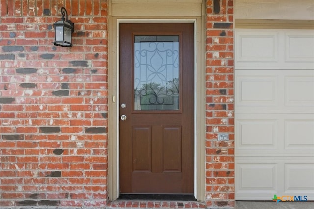 property entrance with a garage