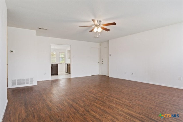 unfurnished room featuring dark hardwood / wood-style flooring and ceiling fan