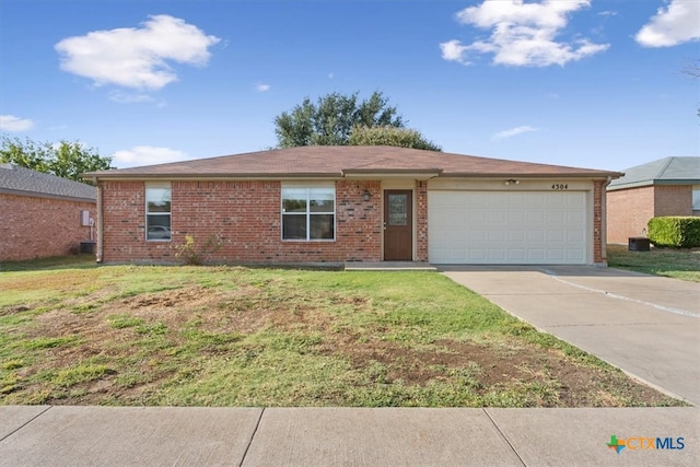 single story home featuring a front lawn and a garage