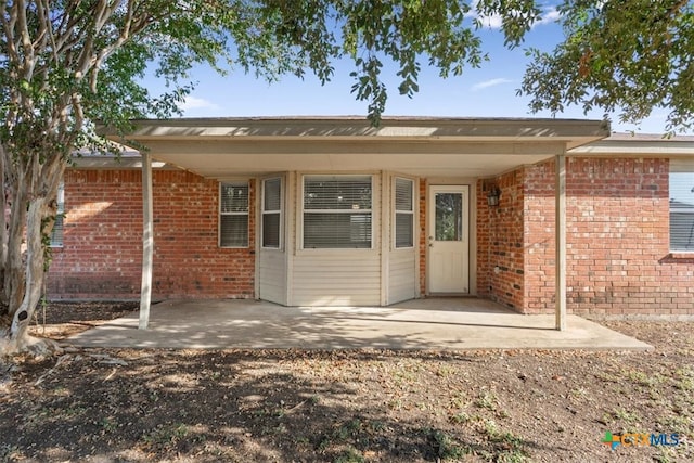 rear view of house with a patio