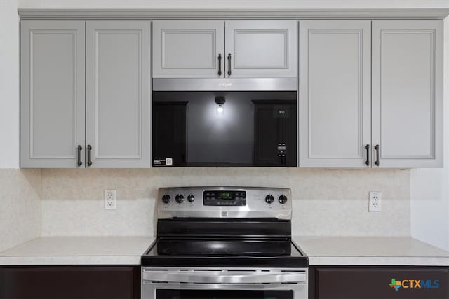 kitchen featuring decorative backsplash and appliances with stainless steel finishes