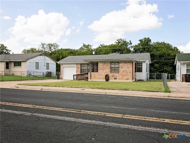 3003 Zephyr Rd, Killeen, TX 76543 - view of front of house with driveway, a garage, and brick siding