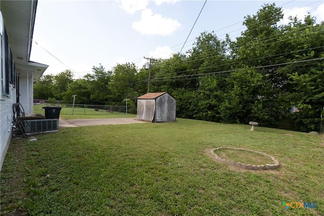 3003 Zephyr Rd, Killeen, TX 76543 - view of green lawn featuring a storage unit and a patio
