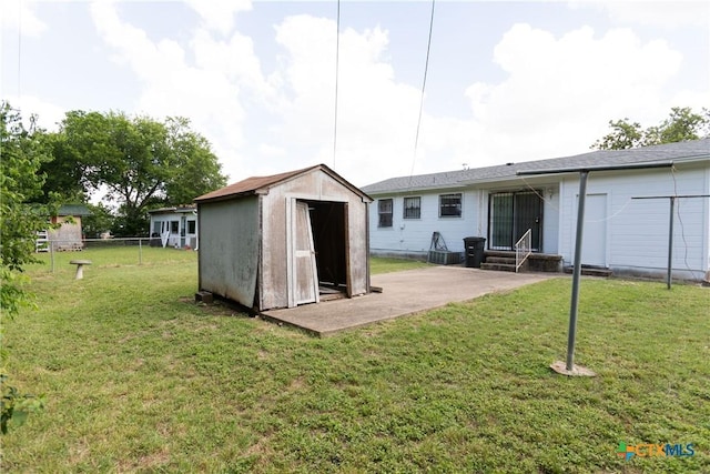 3003 Zephyr Rd, Killeen, TX 76543 - back of property featuring entry steps, a storage shed, and a patio