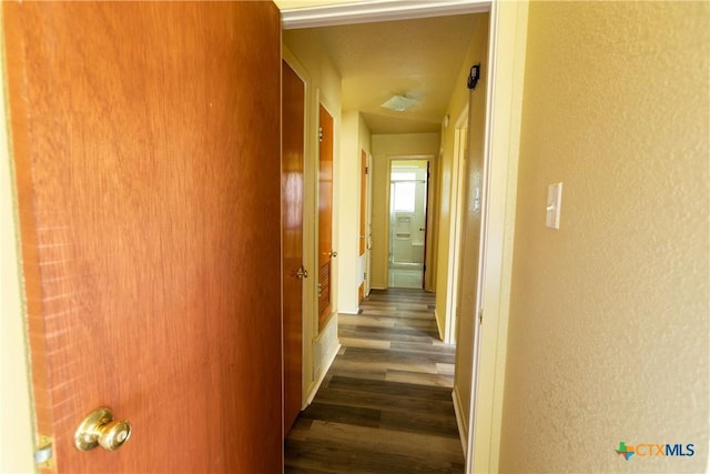 3003 Zephyr Rd, Killeen, TX 76543 - hallway with dark wood-style flooring and a textured wall