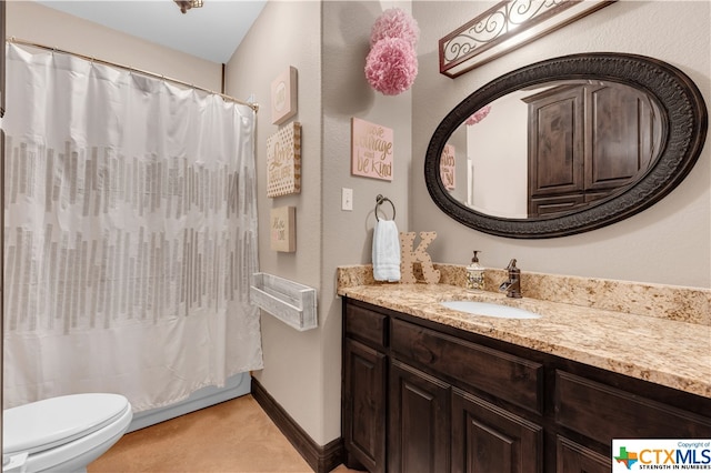 bathroom featuring walk in shower, vanity, and toilet