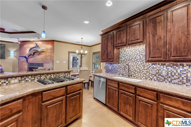 kitchen featuring stainless steel appliances, sink, backsplash, crown molding, and pendant lighting