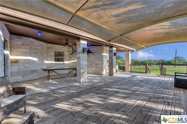 exterior space featuring ceiling fan