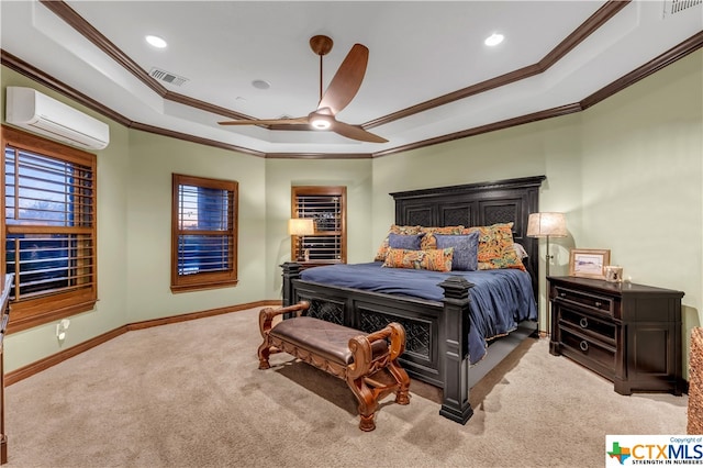 carpeted bedroom featuring ceiling fan, a wall mounted AC, a tray ceiling, and ornamental molding