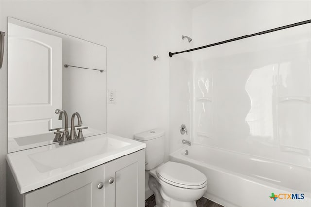 full bathroom featuring vanity, toilet, and  shower combination