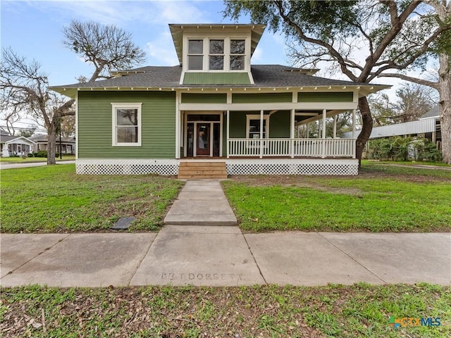 view of front facade with a front yard and a porch