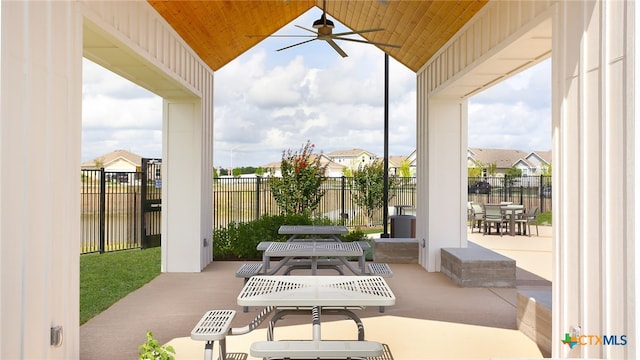 view of patio / terrace featuring a fenced backyard, a ceiling fan, and outdoor dining area
