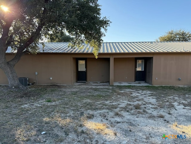 back of property featuring cooling unit