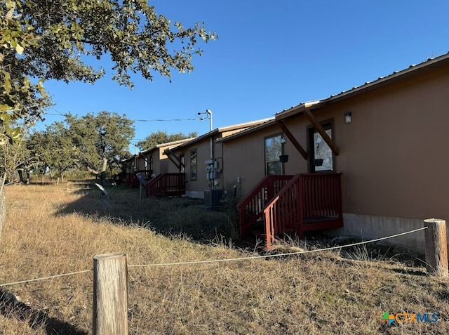 view of property exterior with central air condition unit