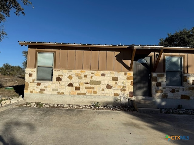 view of side of home featuring a patio