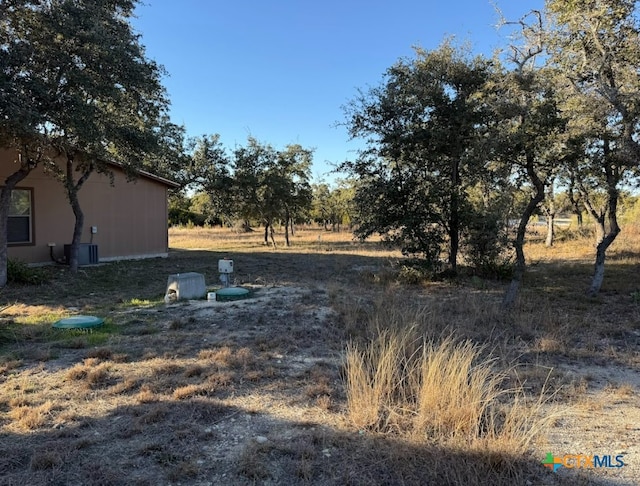 view of yard with central AC