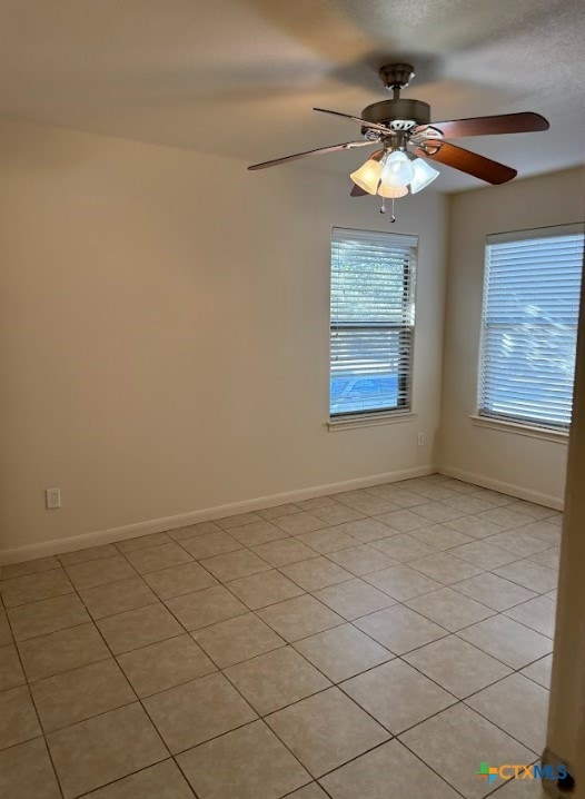 spare room with ceiling fan