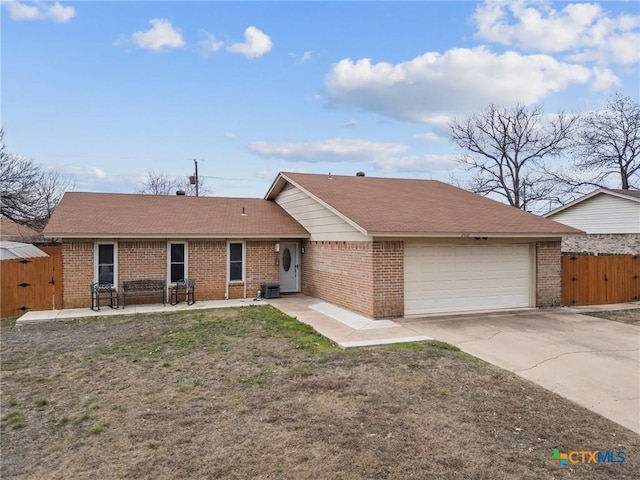 single story home featuring a front yard and a garage