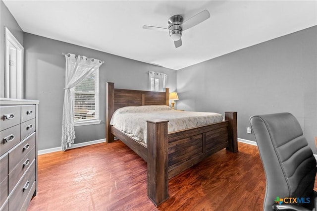 bedroom with hardwood / wood-style flooring and ceiling fan