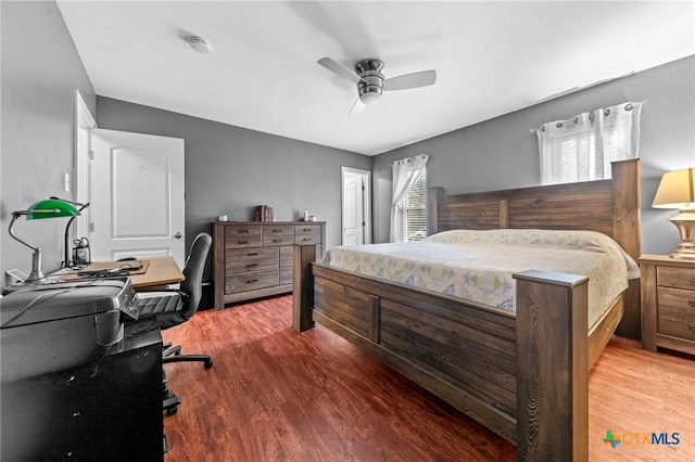 bedroom with wood-type flooring and ceiling fan