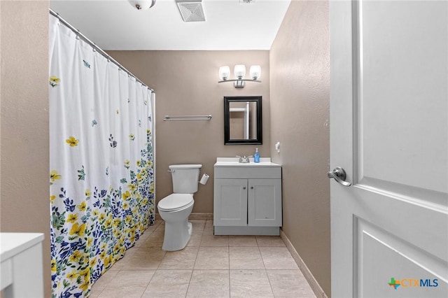 bathroom with vanity, toilet, tile patterned floors, and curtained shower