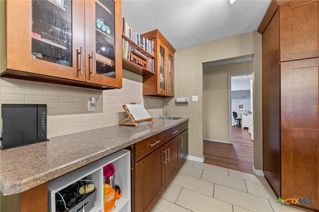 kitchen with sink, backsplash, wine cooler, and light tile patterned flooring