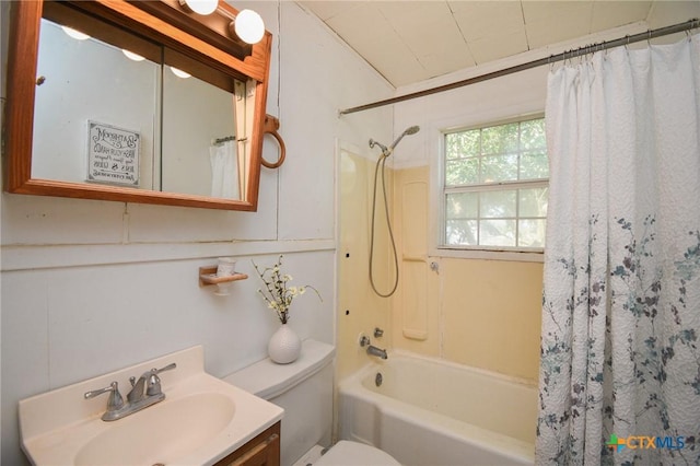 full bathroom featuring vanity, shower / bath combo, and toilet