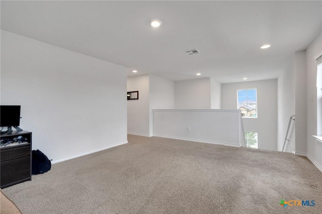 390 Lost Maples, New Braunfels, TX 78130 - unfurnished living room with carpet flooring and recessed lighting