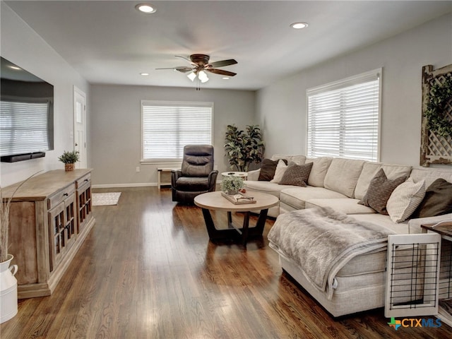 living room featuring recessed lighting, dark wood finished floors, a wealth of natural light, and ceiling fan