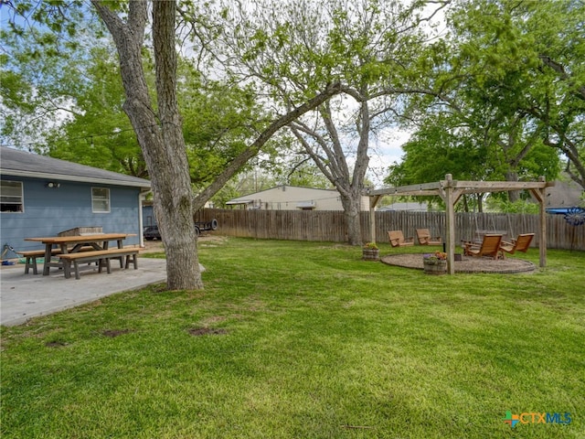 view of yard featuring a patio area and a fenced backyard