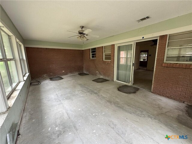 102 E Victory Ave, Temple, TX 76501 - unfurnished sunroom featuring a ceiling fan and healthy amount of natural light