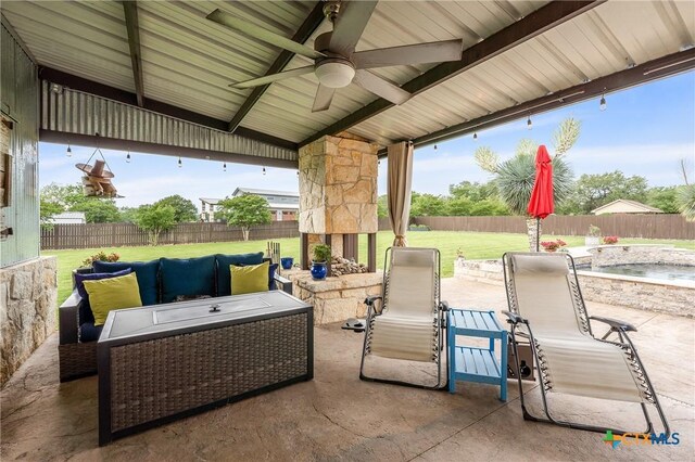 view of patio with a fenced backyard, a ceiling fan, and an outdoor living space