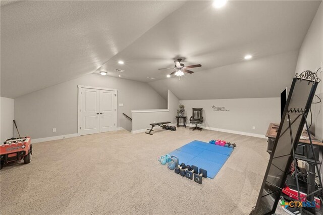 playroom featuring carpet floors, ceiling fan, baseboards, and lofted ceiling