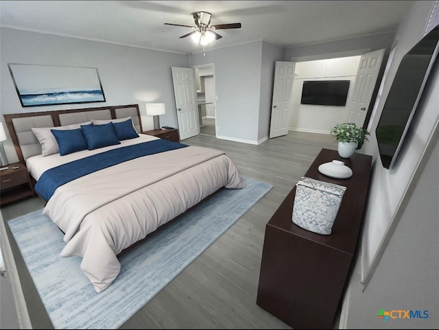 bedroom featuring crown molding, wood finished floors, a ceiling fan, and baseboards