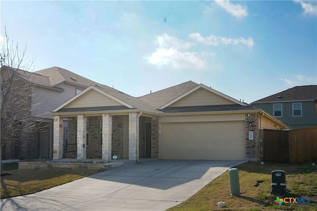 view of front of property featuring fence, roof with shingles, concrete driveway, an attached garage, and brick siding