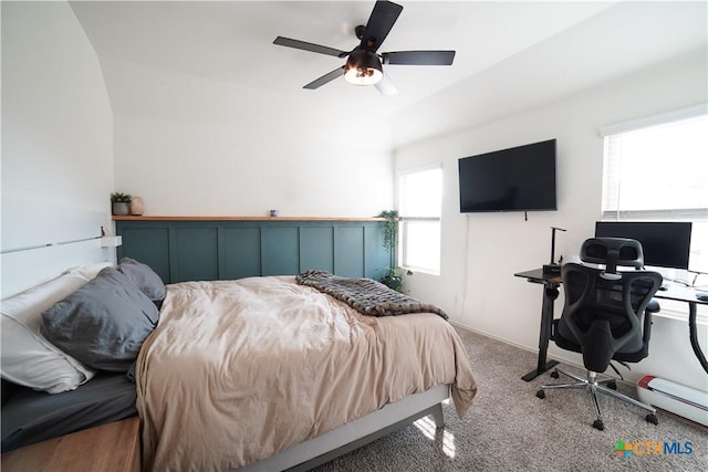 bedroom with baseboards, a ceiling fan, and carpet flooring