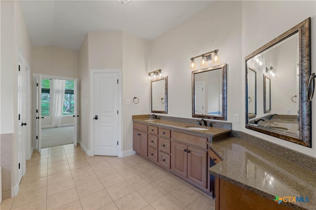 781 Meridian Dr, New Braunfels, TX 78132 - full bathroom featuring double vanity, tile patterned floors, and baseboards