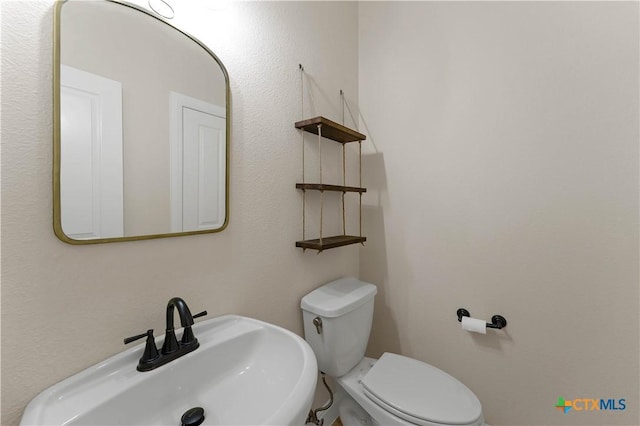 781 Meridian Dr, New Braunfels, TX 78132 - half bathroom with a sink and toilet
