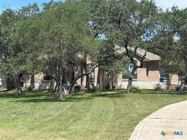 781 Meridian Dr, New Braunfels, TX 78132 - view of front of home featuring brick siding and a front lawn