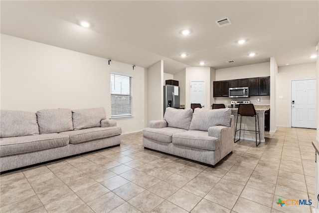 living room featuring light tile patterned flooring