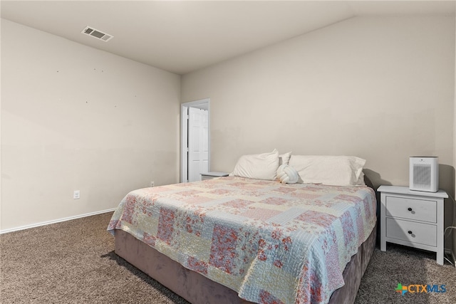 carpeted bedroom featuring lofted ceiling