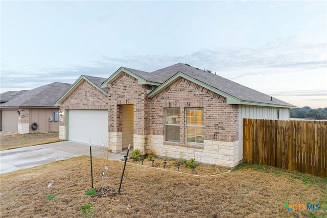 single story home featuring a garage