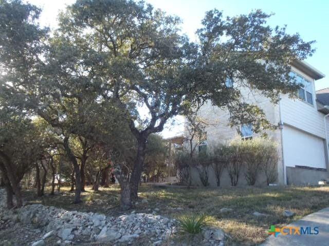 view of side of property with a garage