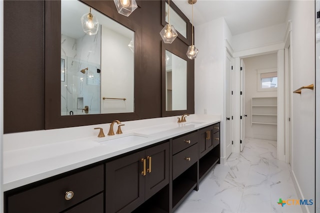 645 Center Grn, New Braunfels, TX 78130 - bathroom featuring a sink, a marble finish shower, double vanity, and marble finish floor